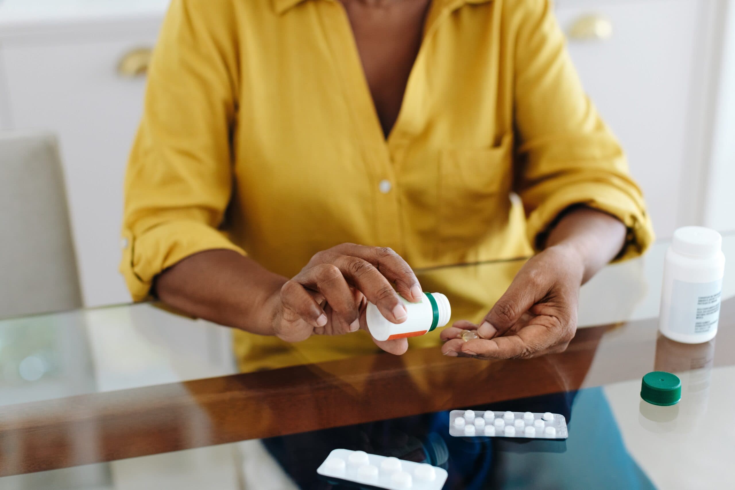 woman taking medication for chronic illness