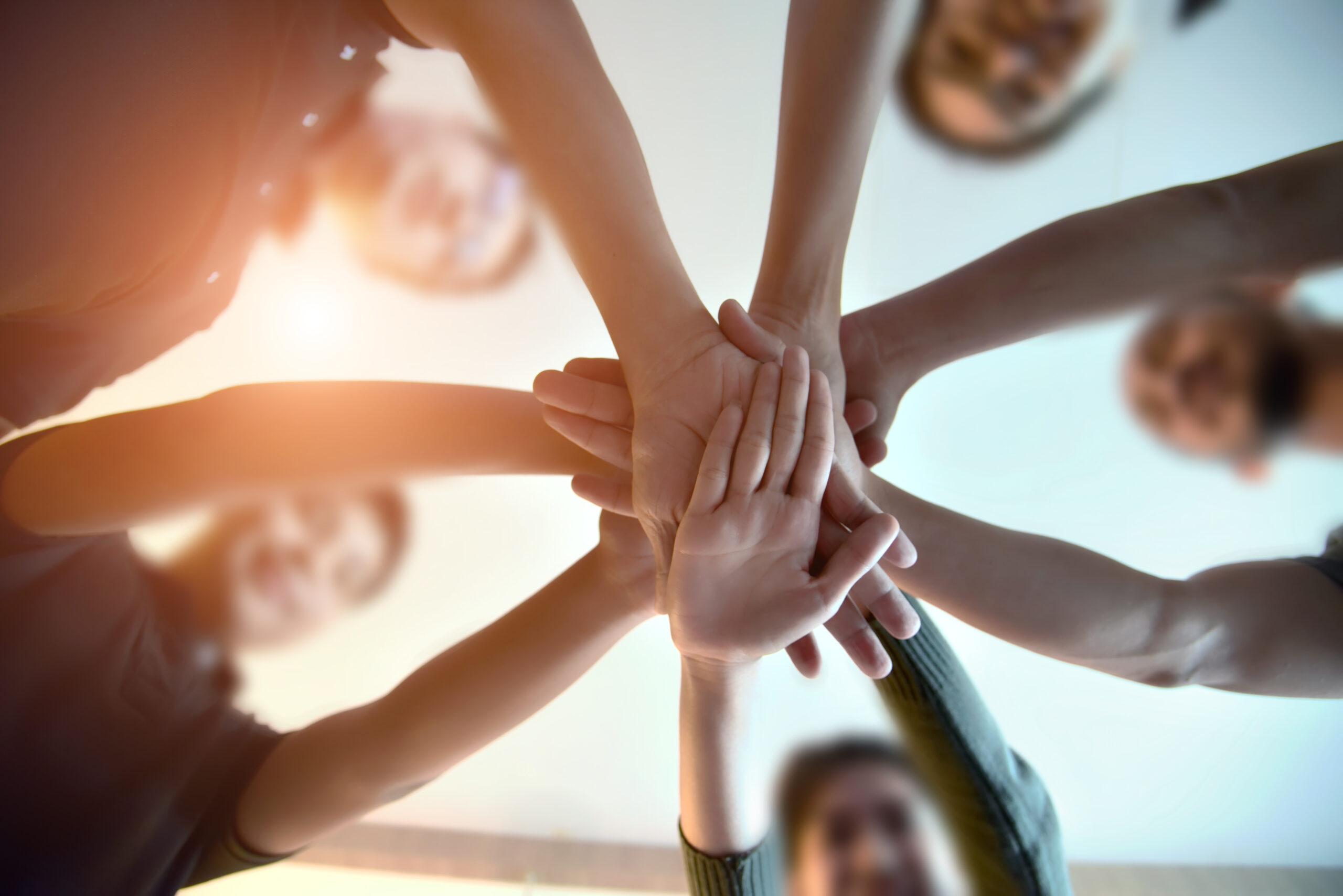 People joining hands in support