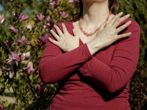 female,touching,and,tapping,her,shoulders,,crossing,hands.,butterfly,hug.