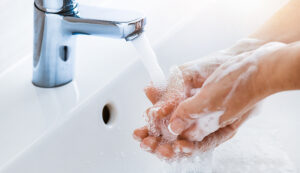woman,use,soap,and,washing,hands,under,the,water,tap.