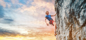 man,rock,climber,with,long,hair.,side,view,of,young