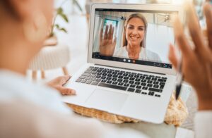 laptop,,video,call,and,mental,health,with,wave,hello,in
